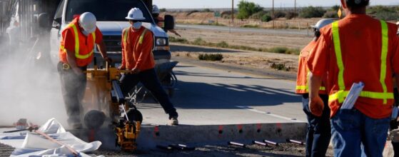 Construction Road Crew Working on Street - Field Service Technician